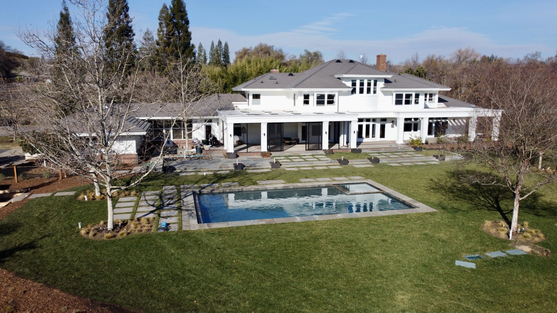 A Modern House with Swimming Pool Under the Blue Sky